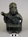 Black pottery human effigy jar