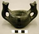 Ceramic bowl, 2 animal handles, burnished design.