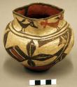Small square-mouthed jar, polychrome, crude birds onneck, geometric on shoulder