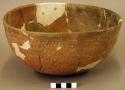 Rubbed indented corrugated pottery bowl