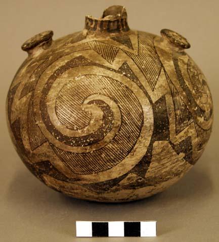 Black on white globular pottery jar with two knobs--for suspension?