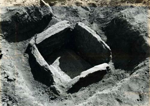 Scan of photograph from Judge Burt Cosgrove photo album. Oct.Nov.1933.  Pandleton Ruin Stone lined bin with shallow metate for bottom.