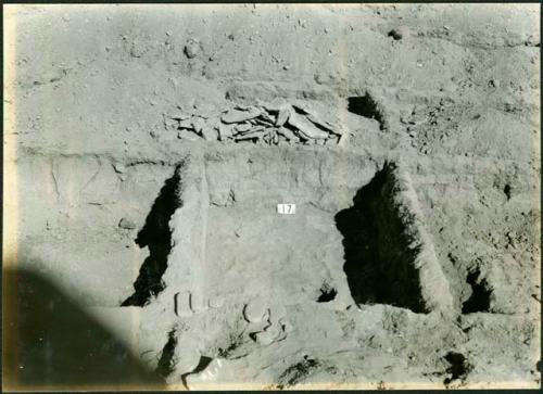 Scan of photograph from Judge Burt Cosgrove photo album. October-November 1933. Pendleton Ruin. Flag stones removedin Room 17 showing the original floor beneath.
