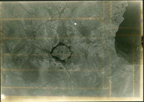 Scan of photogrpah from Judge Burt Cosgrove photo album. October-November 1933. Pendleton Ruin. Plugged cache pit in the floor.