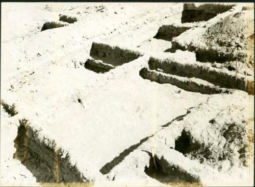 Scan of photograph from Judge Burt Cosgrove photo album. October-November 1933. Pendleton Ruin.Early wall lying below east side of Rooms 5 and 16.