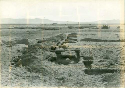 Scan of photograph from Judge Burt Cosgrove photo album. Oct.Nov.1933 Pendleton Ruin.- To East. Room 3 to 10 along north side partially excavated.