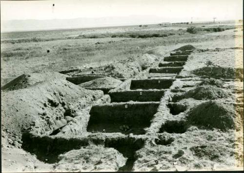 Scan of photograph from Judge Burt Cosgrove photo album. Oct.Nov.1933 Pendleton Ruin.- To East. Rooms 3 to 10 along north side cleared to floors.