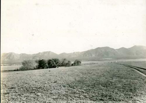 Scan of photograph from Judge Burt Cosgrove photo album. Nov. 15 1933 Old Garcia Ranch at art international line head of Animas Valley New Mex. Sierra Madre mts. in background.