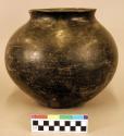 Pottery olla. Globular, concavity in base, short neck with rim thickened