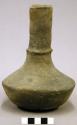 Ceramic vessel, tall neck, flared lip, fillet around neck, flattened base.