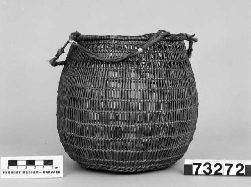 Utility basket with loop handle. From the collection of G. Nicholson and C. Hartman. Open and close twined.