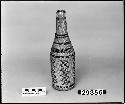 Covered bottle from the collection of E.H. Washburn, ca. 1898. Plain twined, one-face overlay.