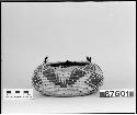 Feathered, beaded, rounded trinket basket. From the collection of Mrs. H.S. Grew. Coiled, three-rod foundation.