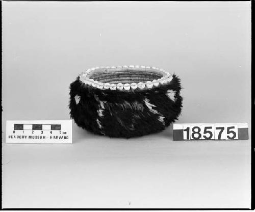 Feathered and beaded basket from the collection of the brothers of Mrs. J.M. Robinson, 1883-1925. Coiled, three-rod foundation.