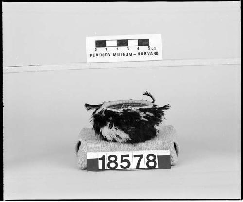 Feathered and beaded basket from the collection of the brothers of Mrs. J.M. Robinson, 1883-1925. Coiled, three-rod foundation.