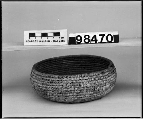 Feathered basket (formerly), from the collection of G. Nicholson. Coiled, three-rod foundation.