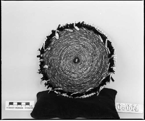 Feathered and beaded plaque. Coiled, three-rod foundation. From the collection of C.P. Wilcomb.