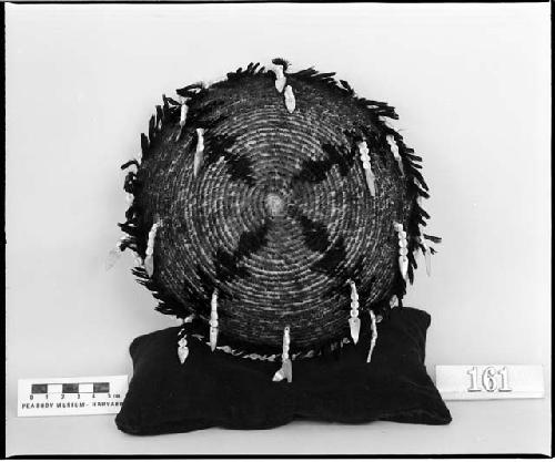 Feathered and beaded plaque. Collected 1900. Coiled, three-rod foundation.