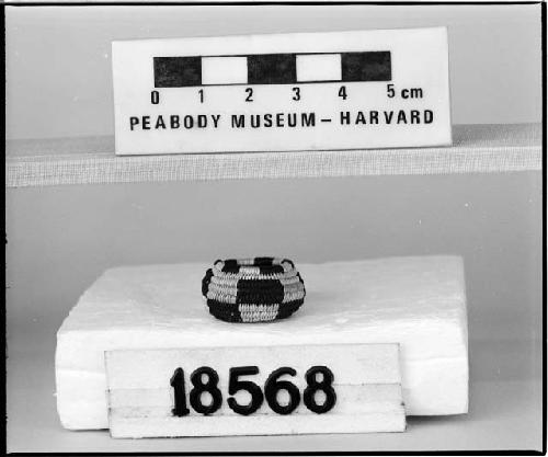 Miniature basket from the collection of the brothers of Mrs. J.M. Robinson, 1883-1925. Coiled, three rod or bundle.