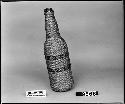 Covered bottle, from the collection of the parents of L. Frankenstein, pre-1902. Diagonal twined.