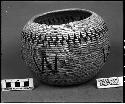 Storage bowl made by Old Jennie, Bald Rock. Collected by G. Nicholson and C. Hartman. Coiled, three rod, some split stitches.