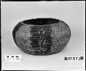 Globular basket collected by G. Nicholson. Coiled, three-rod foundation.