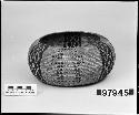 Globular basket from unknown collection. Coiled.