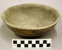 Ceramic shallow bowl, punctate pattern at rim, exterior polished