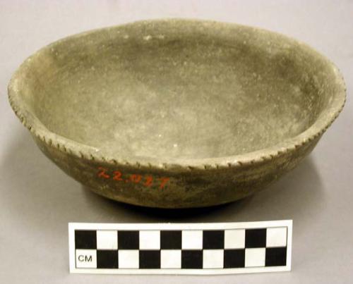Ceramic shallow bowl, punctate pattern at rim, exterior polished