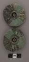 Pair of carved jade ear-flare ornaments - rosette type