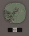 2 fragments of carved jade rosette