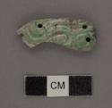 One fragment of white and green jade carving - serpent head - partially decompos