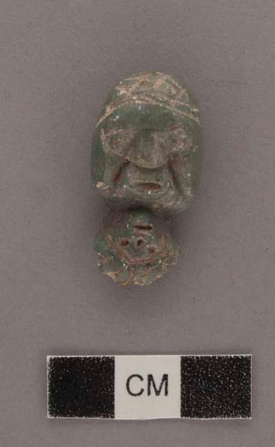 Double greenstone figure - head each way