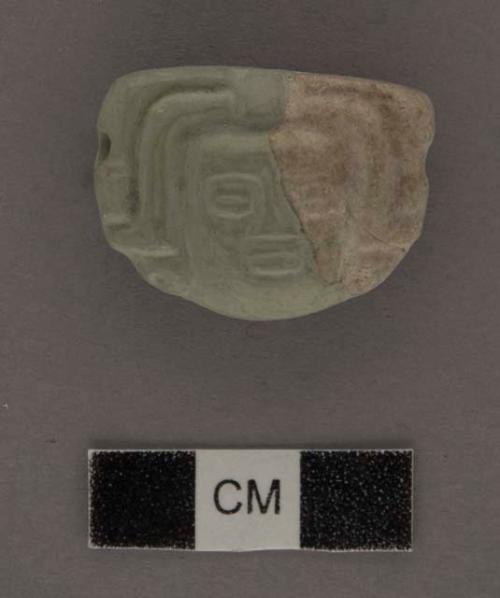 Fragment of flat jade  human head - 21.1x15.8x10.9 mm.