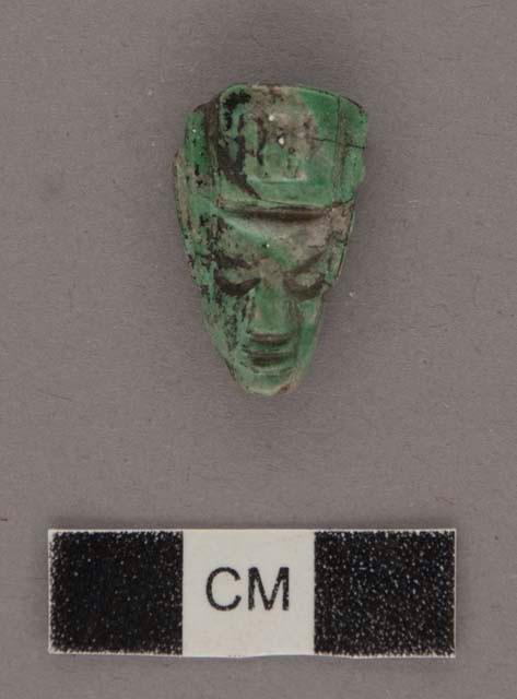 Carved jadeite ornament, human face