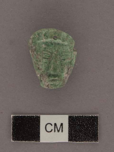 Carved jadeite ornament, human face