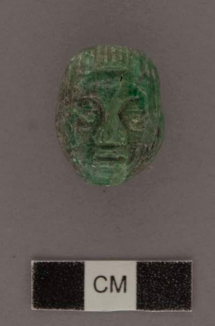 Carved jadeite ornament, human face
