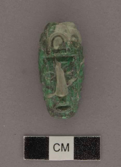 Fragment of jade bead or pendant, human head