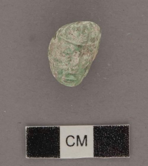 Carved jadeite ornament, human face