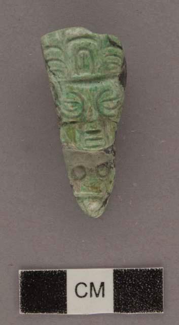 Portion of carved jadeite ornament, human face