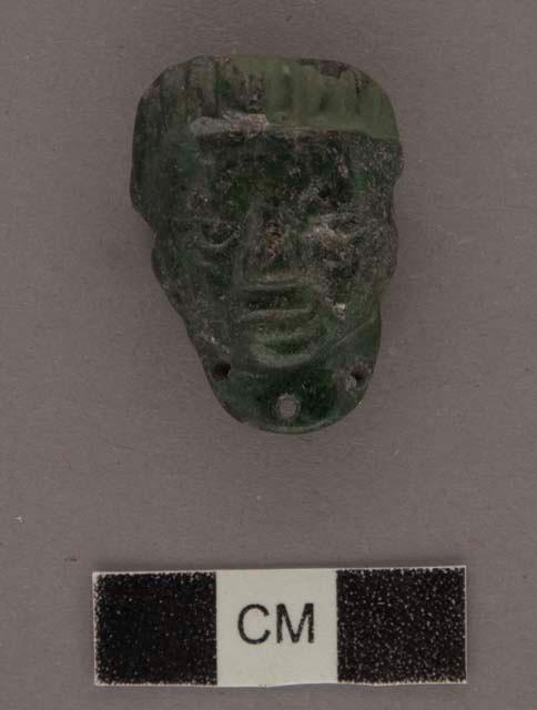 Carved jadeite ornament, human face