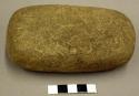 Ground stone metate, rectangular