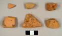 Handmade brick fragments and at least one refined redware sherd with lead glaze