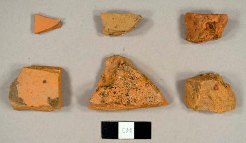 Handmade brick fragments and at least one refined redware sherd with lead glaze