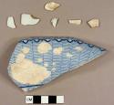 One clinker fragment and six pearlware sherds, including one rim sherd to a possible tureen with blue transfer print