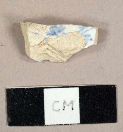 Ironstone sherd, possibly a base sherd to a saucer with blue on white transfer print on interior