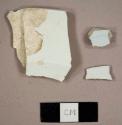 Whiteware and ironstone sherds, including one whiteware plate rim