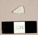 Curved white plastic fragment, possibly from a spoon