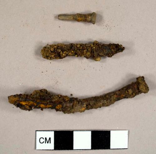 Nails and nail fragments, including at least one machine cut nail