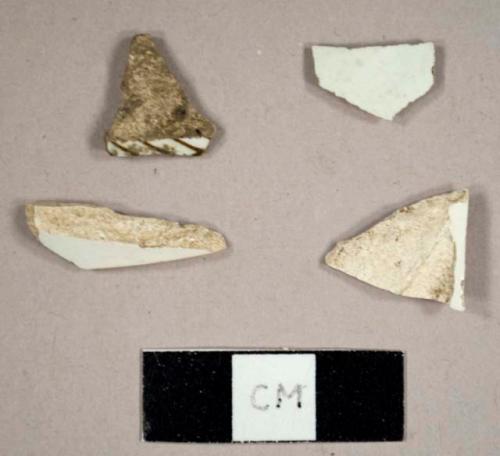 Pearlware sherds, including one possible foot sherd to a cup and one with brown transfer print